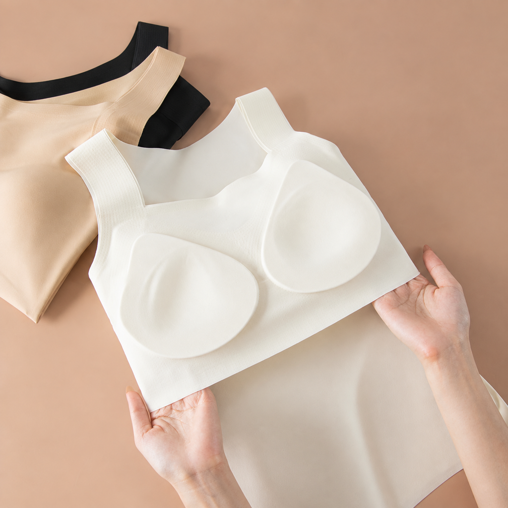 The Faye tank held open, showing the two shaped cups stitched into the built-in shelf bra